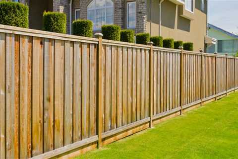 How much does it cost to build a wooden fence around a house?